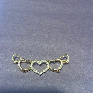 Goldtone and rhinestone pin